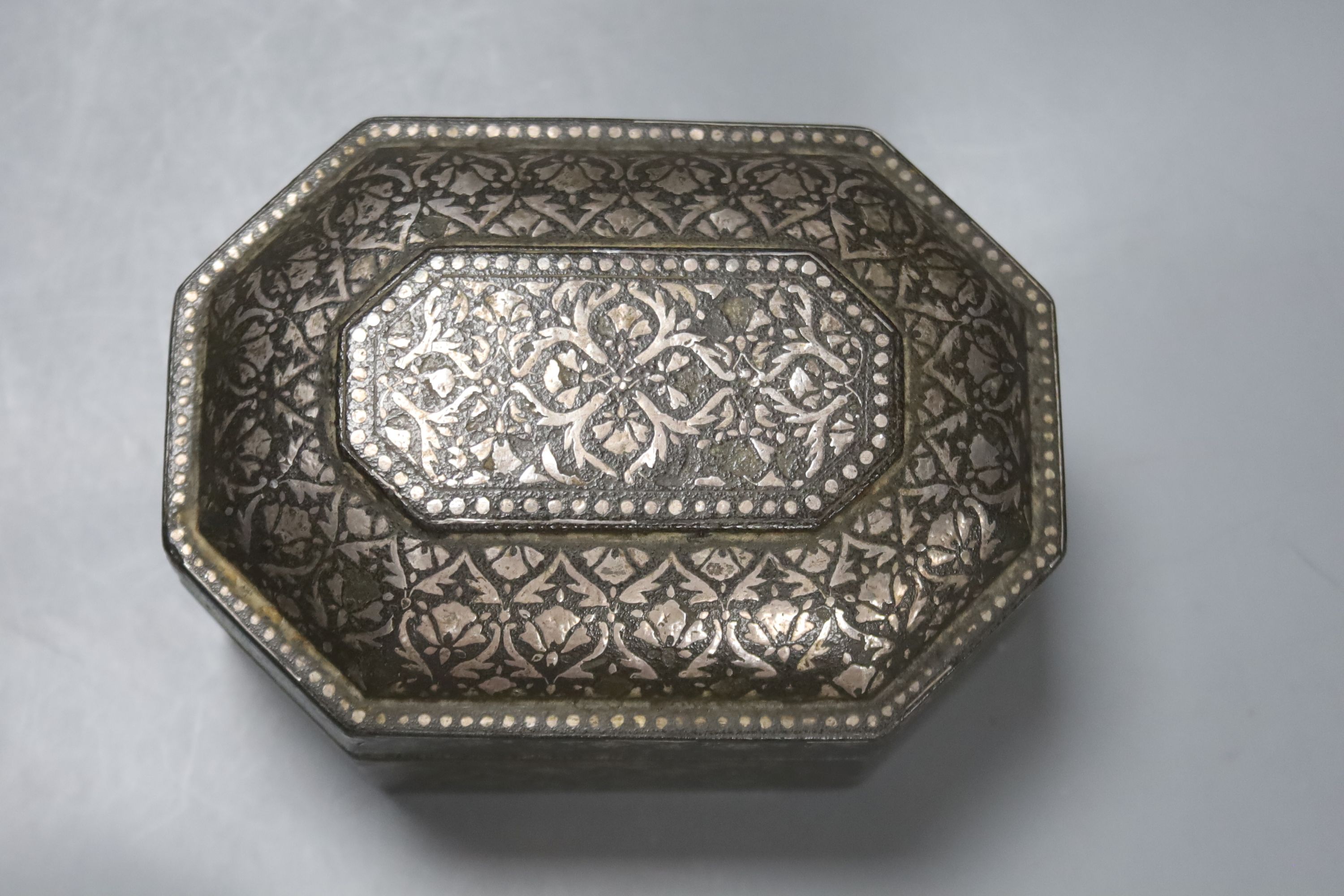 A 19th century Indian Bidri ware octagonal casket, 7cm high, 11x15 cm.